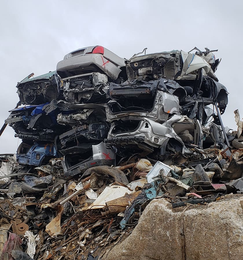 pile of scraped junk cars